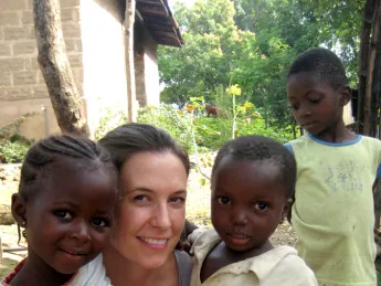 Theresa Betancourt with children in Sierra Leone