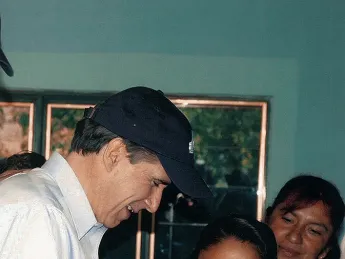 Julio Frenk, as Mexico’s minister of health, administers oral polio vaccine to a baby in a rural  community during National Health Week in 2005.