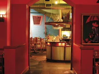 Rich colors and paintings by Latin American artists add to Merengue’s vibrancy. 