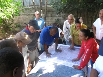 This image, provided by a member of the Boston University delegation upon his return from Haiti, shows the wall map sheets printed at Harvard being used for damage assessment surveys.