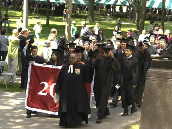 Seniors, led by the Reverend Peter Gomes and their class marshals, head to Baccalaureate.
