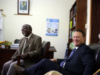 David Bangsberg (center) meets with Frederick Kayanja, vice chancellor of Mbarara University of Science and Technology (MUST) in Mbarara,Uganda, in Kayanja's office.