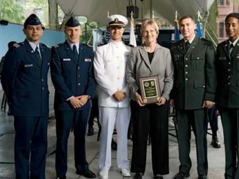 At the ROTC ceremony, from left to right: U.S. Air Force second lieutenants Roberto A. Guerra and Michael J. Arth, U.S. Navy ensign John D. Reed, President Faust, and U.S. Army second lieutenants Jason M. Scherer and J. Danielle Williams.