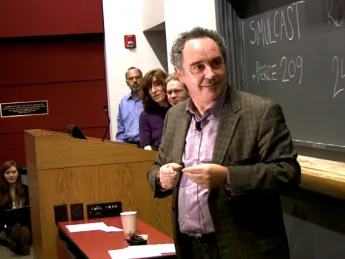 Ferran Adrià, dubbed the father of molecular gastronomy, pauses to let molecular geneticist Roberto Kolter (at right) translate during Adrià’s public lecture at Harvard.