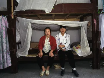 Factory girls in their dormitory, Guangdong Province