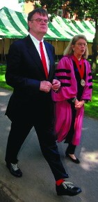 Keillor walking (bright red socks and 'clunky' black shoes visible)