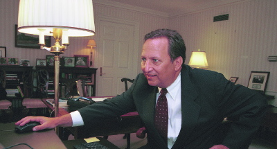 Summers in his office, using computer