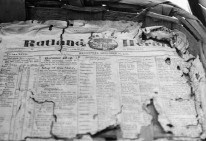 image of torn newspaper before restoration