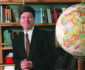 Jeffery Sachs, by a globe in his office