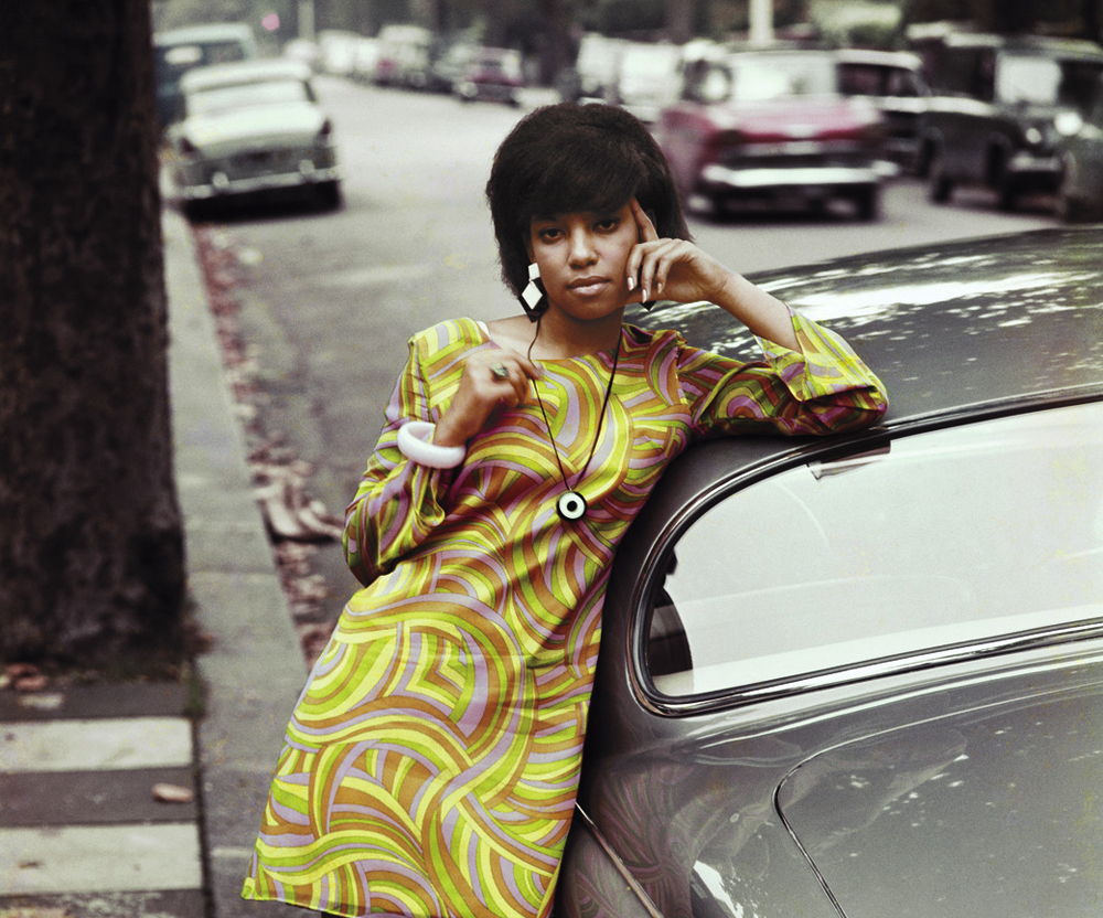 lady leaning on car