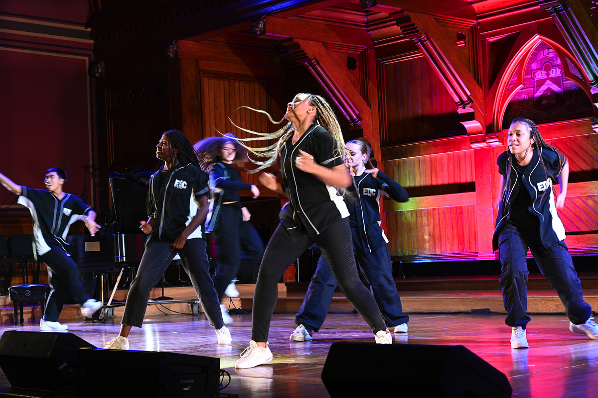 A group of people dancing on stage