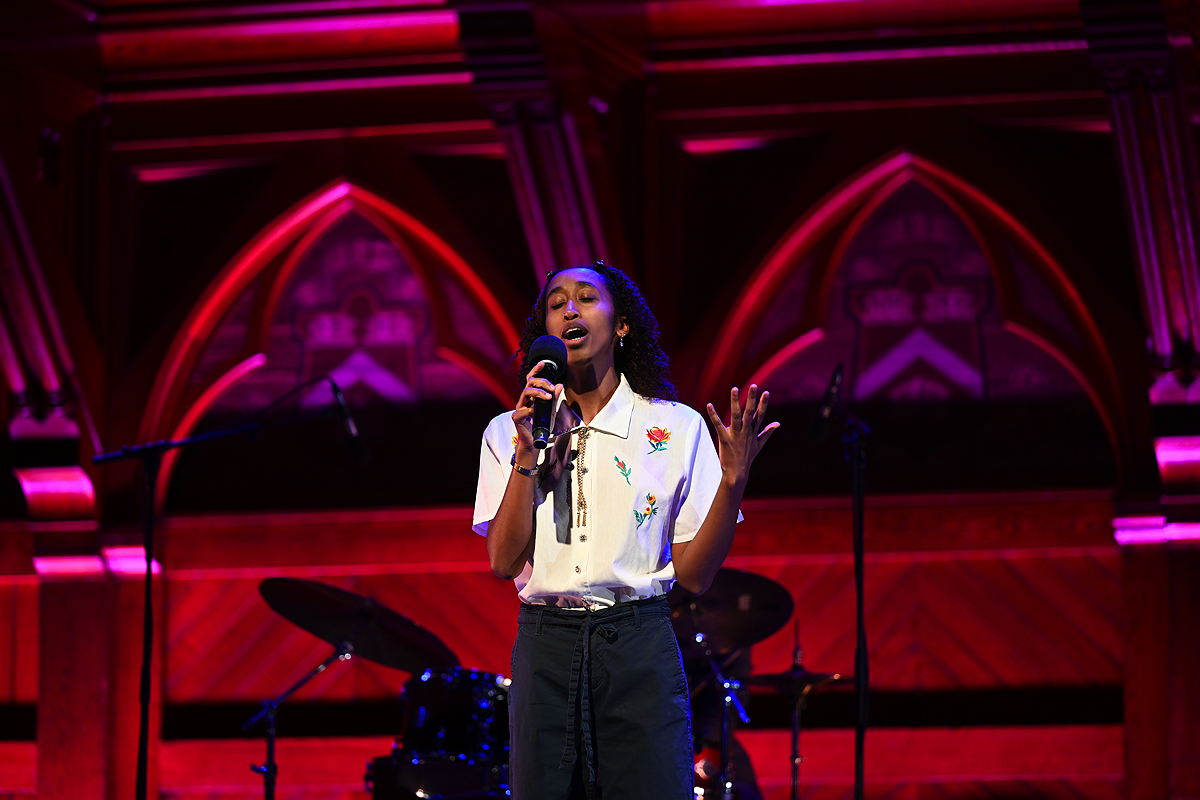 Woman singing on stage