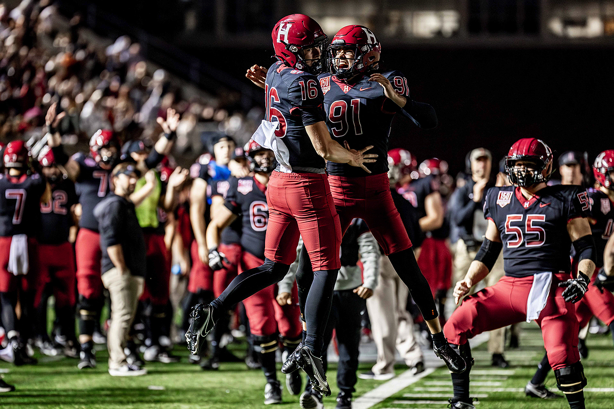 Harvard players #16 and #91 celebrate 