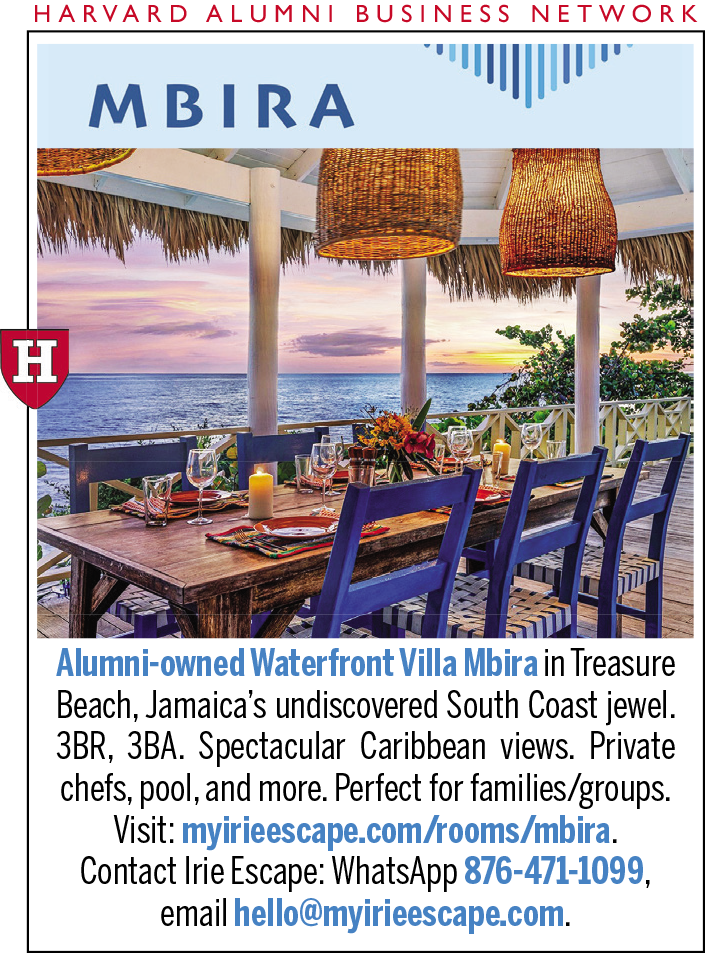 Cozy dining area with ocean view, vibrant sunset, and tropical decor.