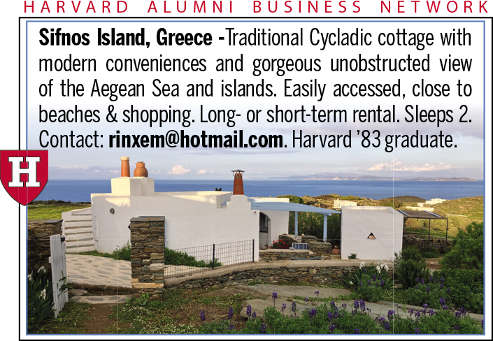 Traditional Cycladic cottage in Greece with a view of the Aegean Sea and surrounding landscape.