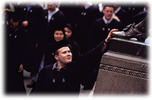  Processing to the Baccalaureate service on Tuesday of Commencement week, Alden M. Strock '96, of Lowell House and New York City, gives an affectionate pat to John Harvard's toe.
