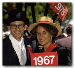 Aide Robert Bikel '91, G '92, of Beverly Hills, California, and Erika Forbes '91 of Washington, D.C., distribute class signs to marchers.