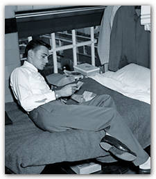 Letter from home: Paul Ode '51 on his cot on the balcony of the Indoor Athletic Building, September 25, 1947. The arrival of veterans had led to serious overcrowding..