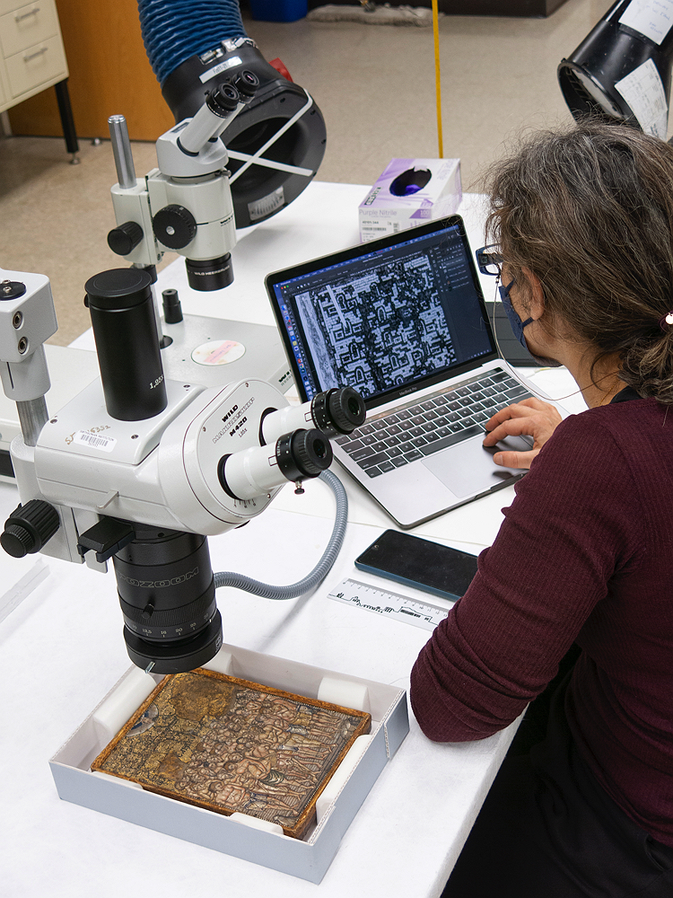 mosaic being scanned and observed on a computer screen