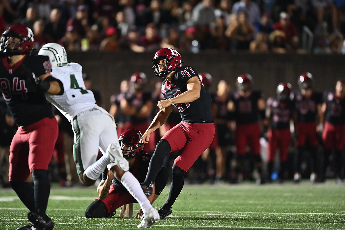 Harvard player kicks ball