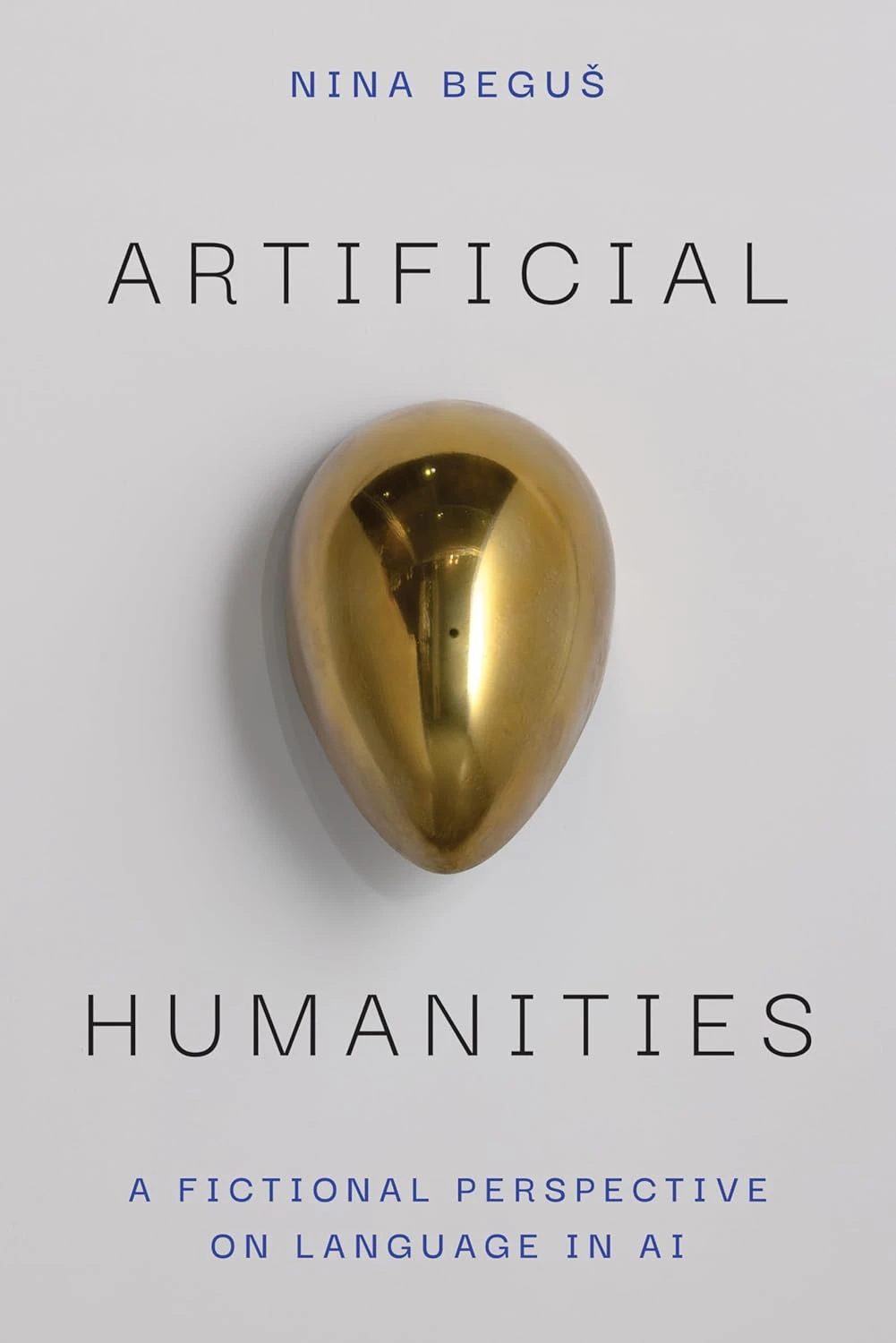 Book cover for "Artificial Humanities" with a shiny gold round object 