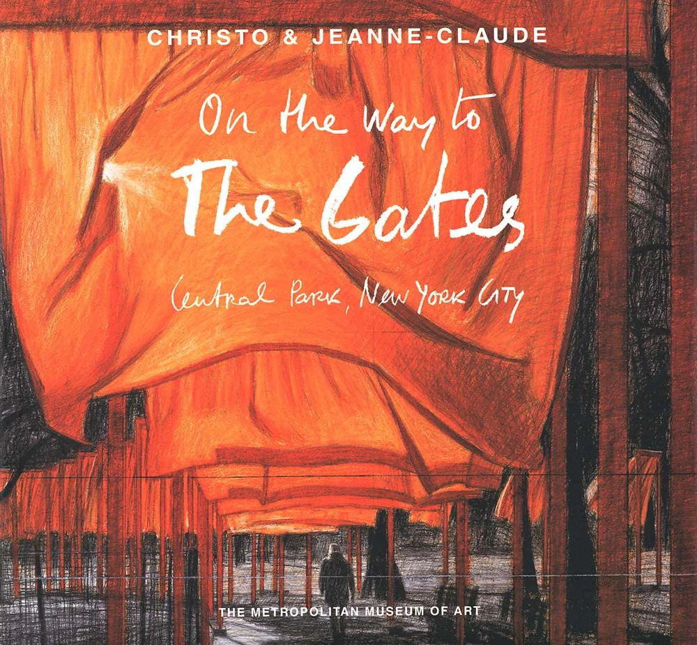Book cover for "Christo and Jeanne-Claude: On the Way to the Gates, Central Park, New York City" by Jonathan Fineberg, with a photograph of  "The Gates" in Central Park, a large art piece created by orange fabric,by Christo and Jeanne-Claude