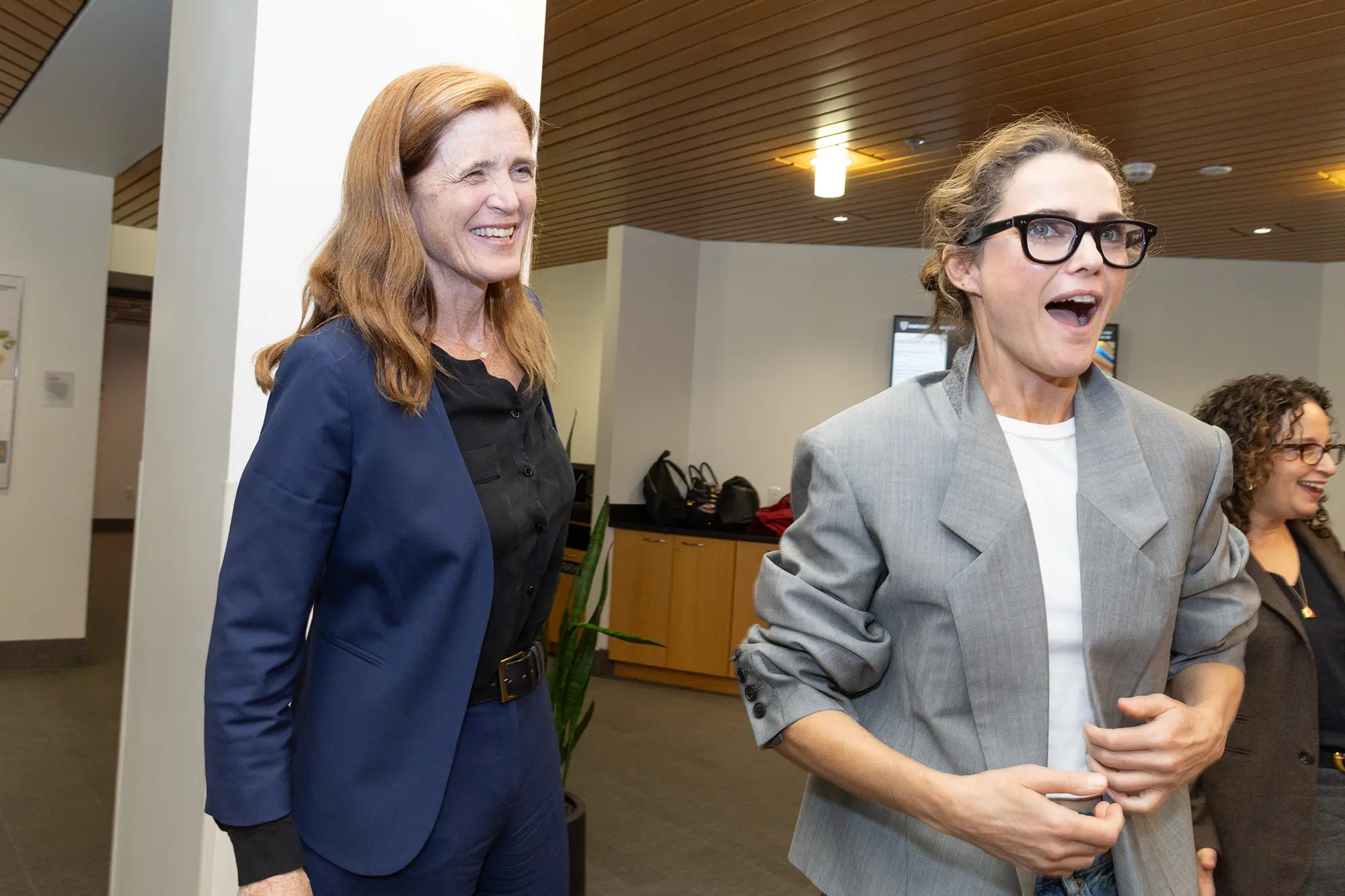 Samantha Power smiles next to Keri Russell