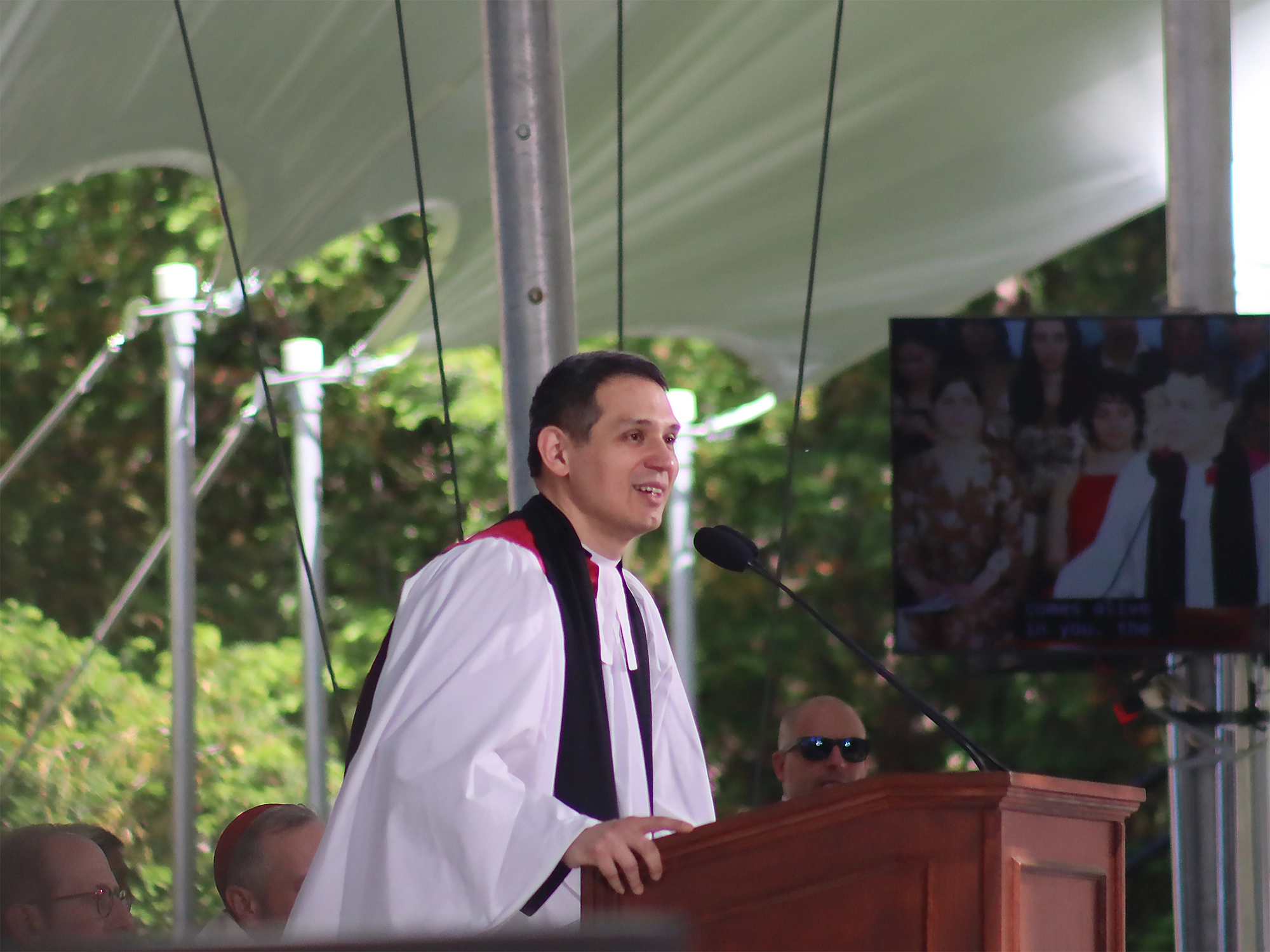 Matthew Potts speaks at a podium