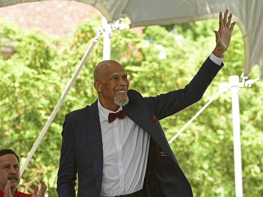 Kareem Abdul-Jabbar waves at the crowd