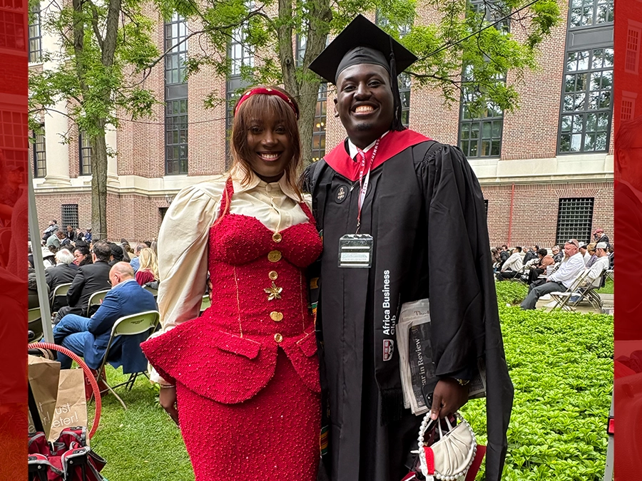 Kiiki Quarm, wearing a dress that was custom-made in Nigeria, with Jesse Ovia, M.B.A. ‘25