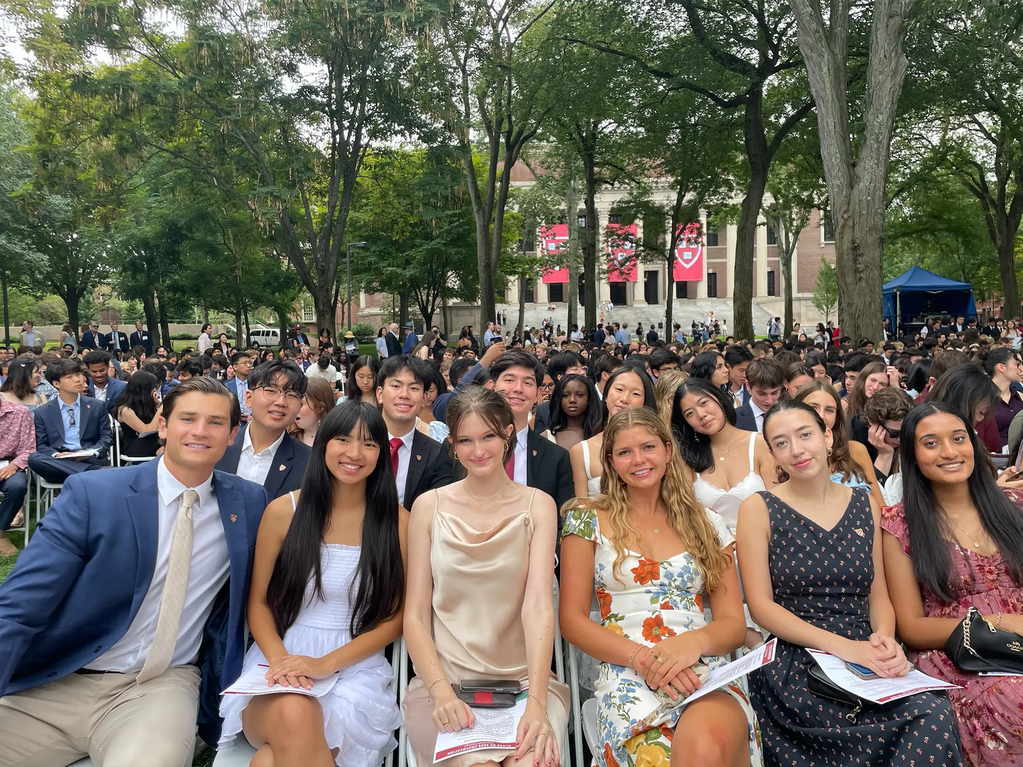 Members of the freshman class sitting in Tercentenary Theatre