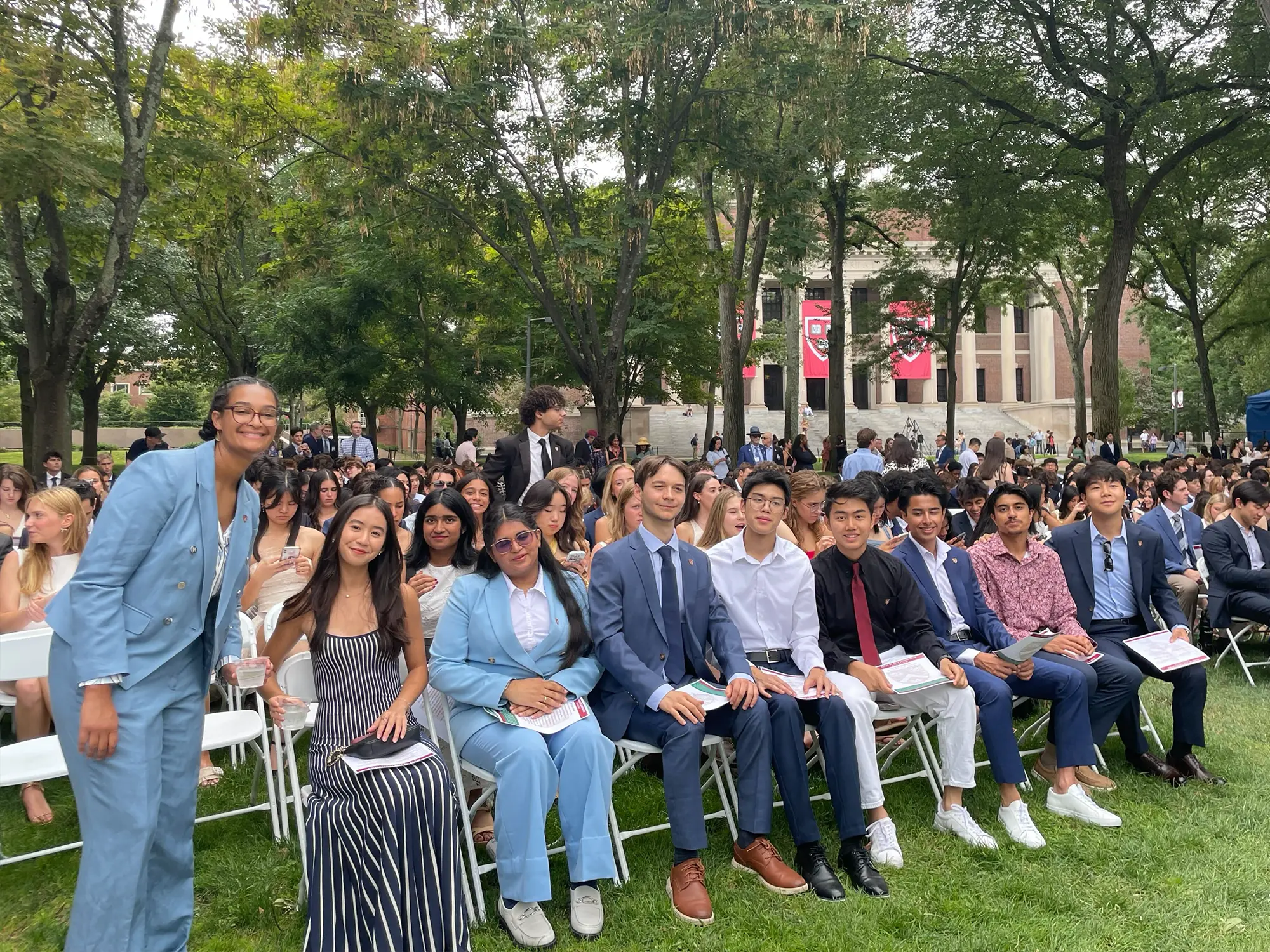 Members of the freshman class sitting in Tercentenary Theatre
