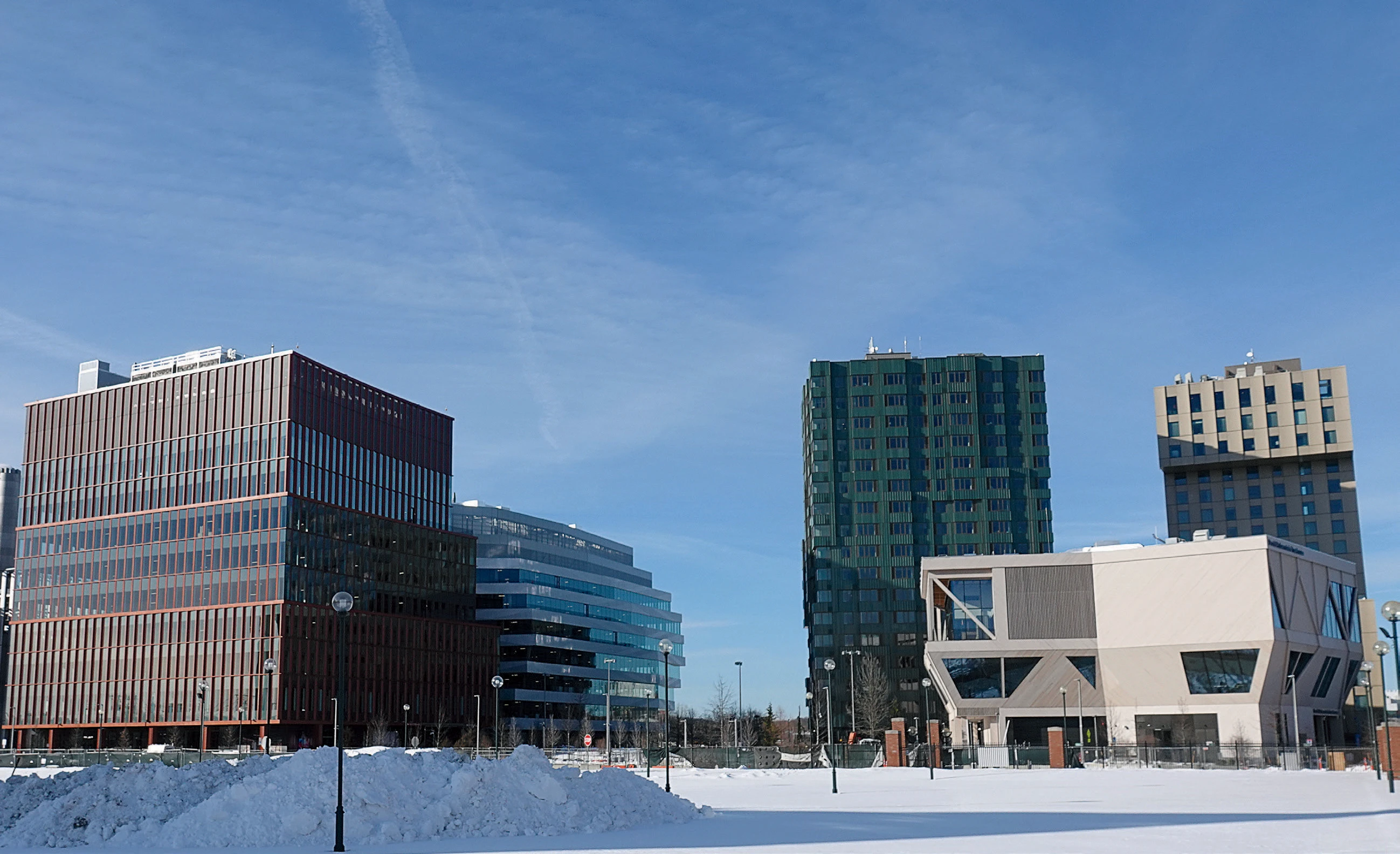 Enterprise Research Campus in Allston with lab buildings, hotel tower, and conference center in winter.
