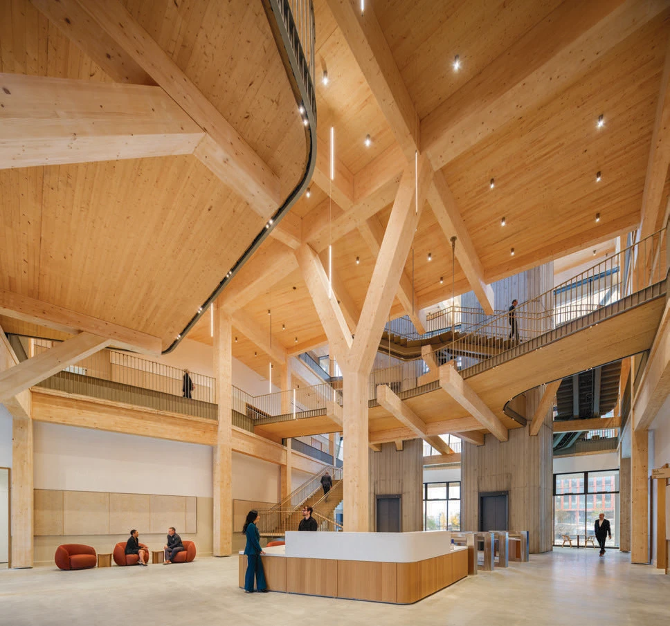 Treehouse conference center lobby with exposed timber beams and central reception desk.