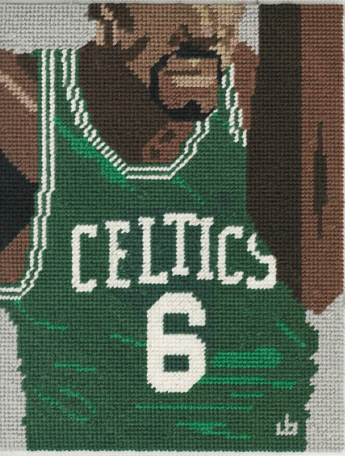 Needlepoint of basketball player in green Celtics jersey number 6, mid-action close-up.
