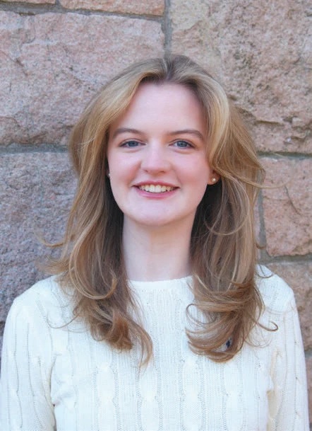 A woman with blonde hair smiling