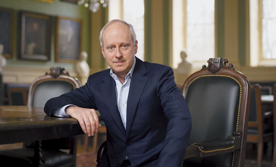 Michael Sandel sitting in the Faculty Room in University Hall