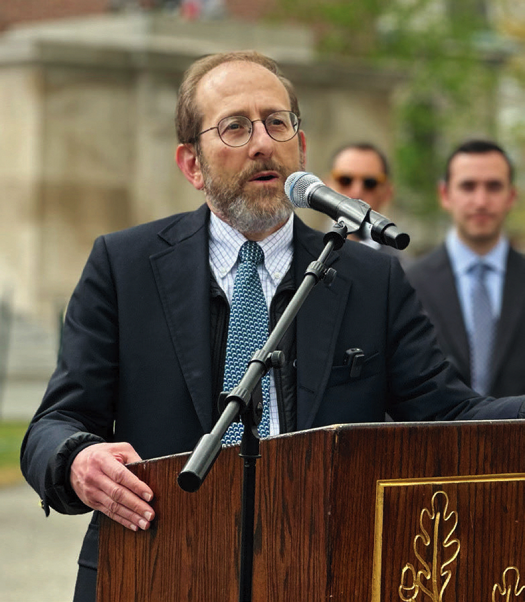 Alan M. Garber speaking at podium