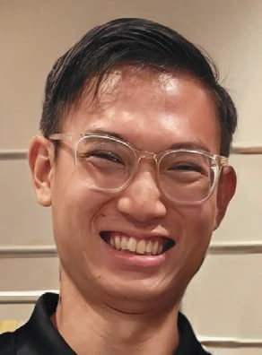 Man smiling and wearing glasses