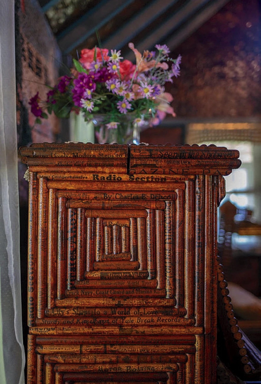 Close-up of piano side crafted from tightly rolled newspaper strips.