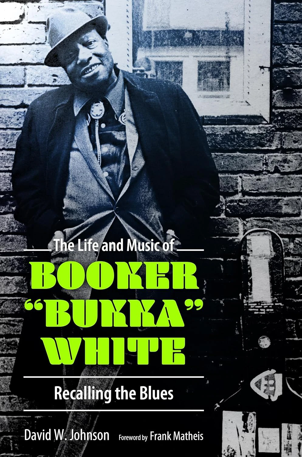 Book cover for "The Life and Music of Booker 'Bukka' White: REcalling the Blues" by David W. Johnson with a black and white photograph of Booker White