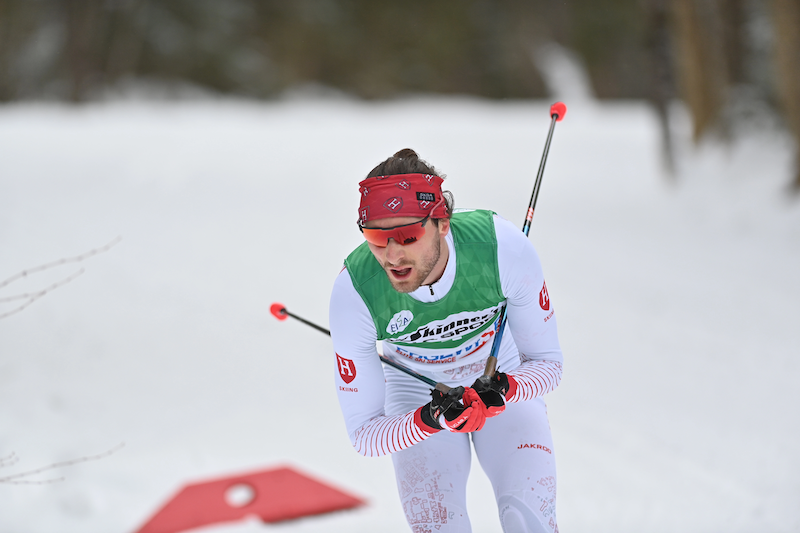 Skier Remi Drolet on the course with glasses and poles