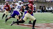 Harvard sophomore safety Ty Bartrum runs an intercepted St. Thomas pass back 96 yards for a touchdown.