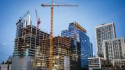 City skyline with construction of skyscrapers in the foreground