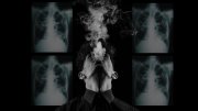 a person smoking in the foreground with x-rays of tuberculosis in the background