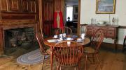 Kitchen at Whittier Birthplace with round wood table and 4 chairs and wood surround fireplace