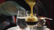 Pouring the creamy “Sai  Gon Latte” at Cicada Coffee Bar in Central Square