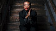 Portrait of Kimberly Dowdell sitting on steps
