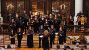 Boston Camerata performing in 2022, with a conductor in front