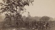 Union soldiers standing near the bodies of dead Confederate soldiers September 19, 1862, on Miller farm.